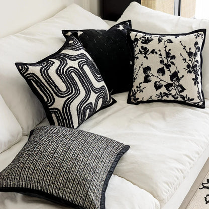 Housse de coussin blanc et noir