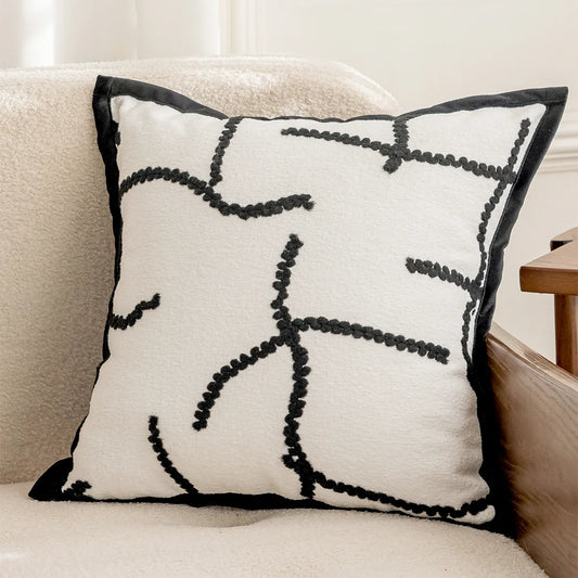 Housse de coussin blanc et noir